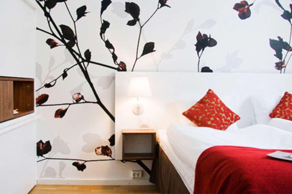 Desk, blackout drapes, bed sheets