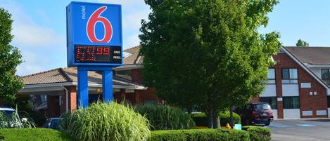 A motel sign with a digital display indicating a price of $79.99 per person.