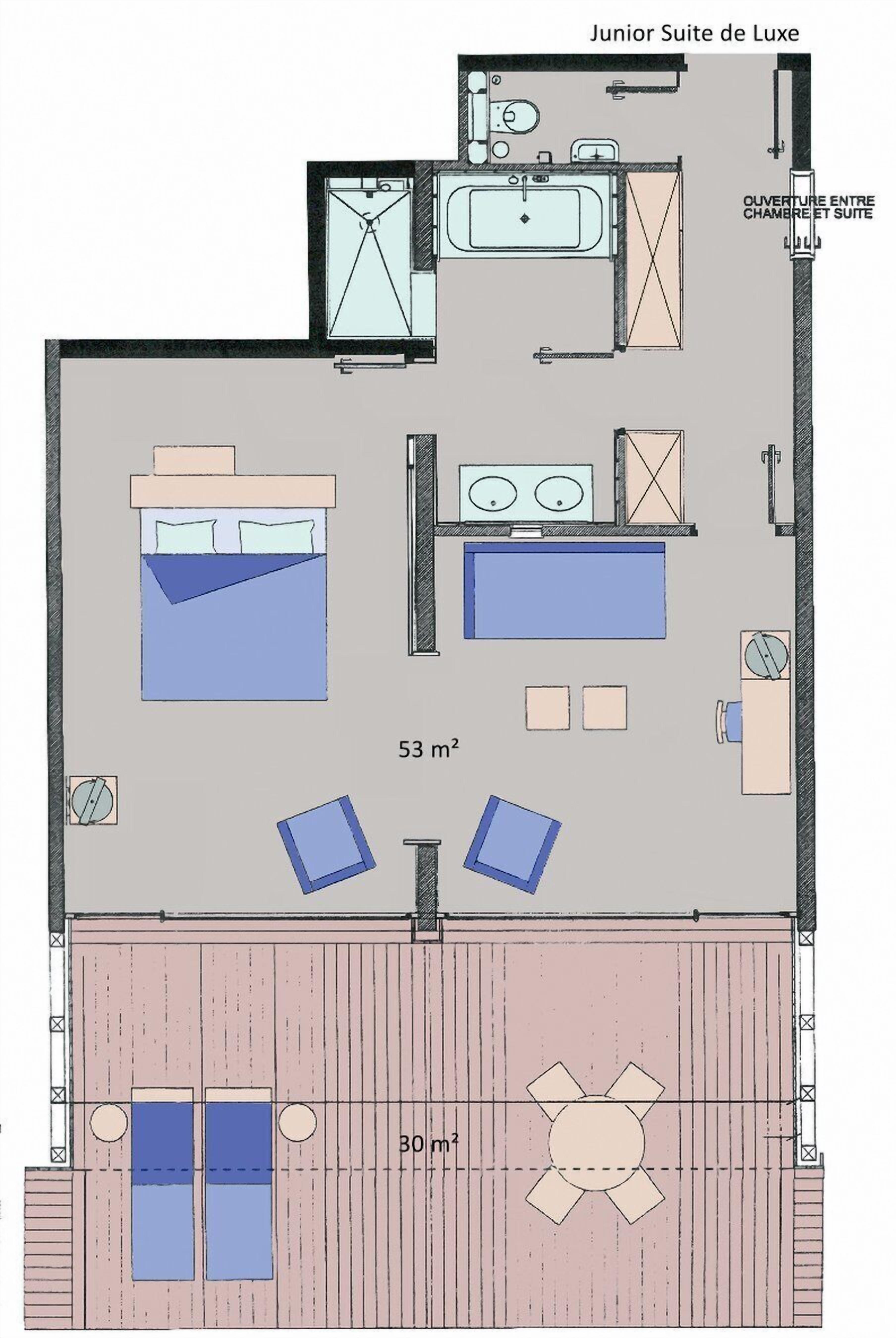 A junior suite layout with a bed, two bedside tables, a desk, a chair, a small bathroom, and an outdoor area with a table and chairs.