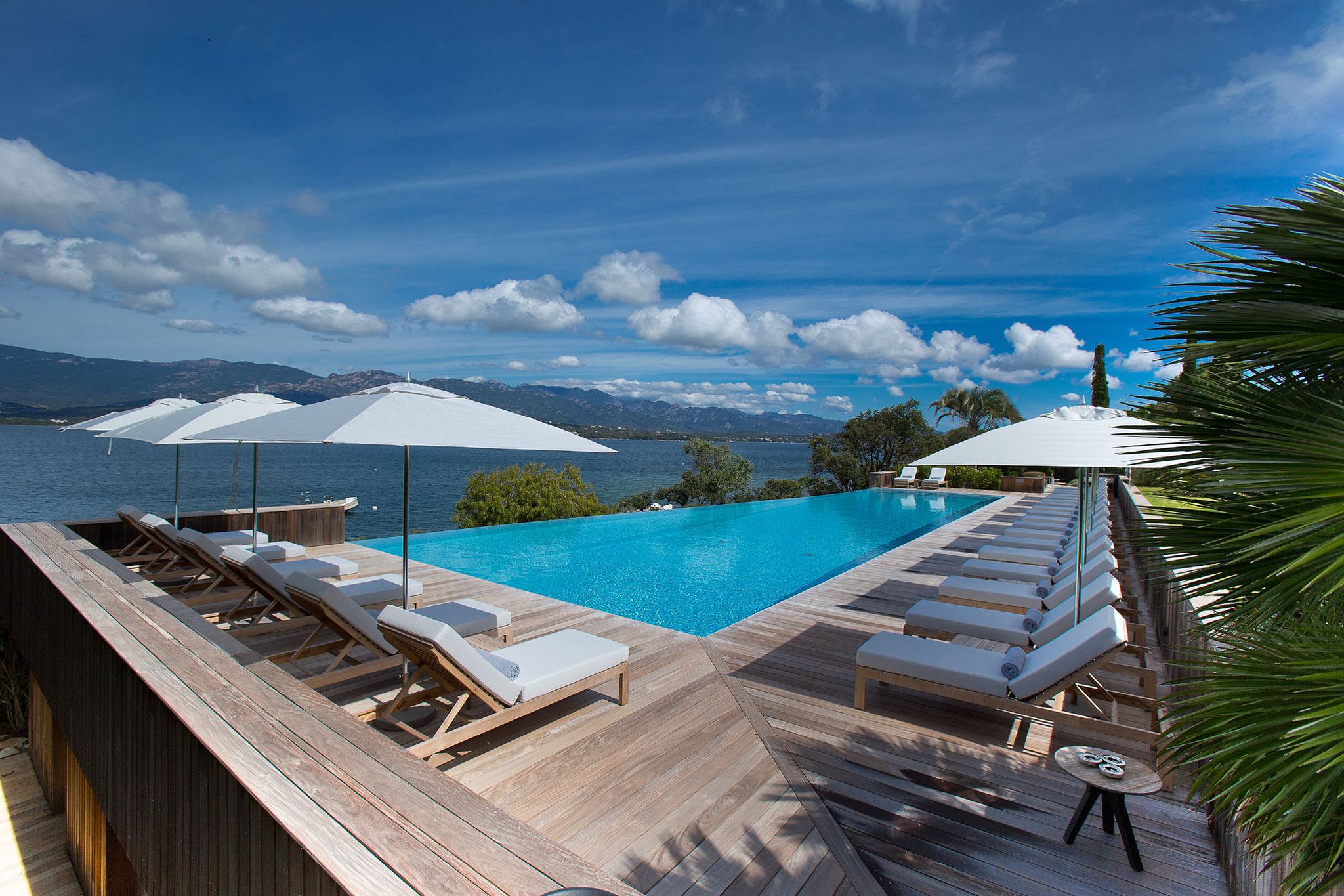 outdoor pool, pool umbrellas, pool loungers