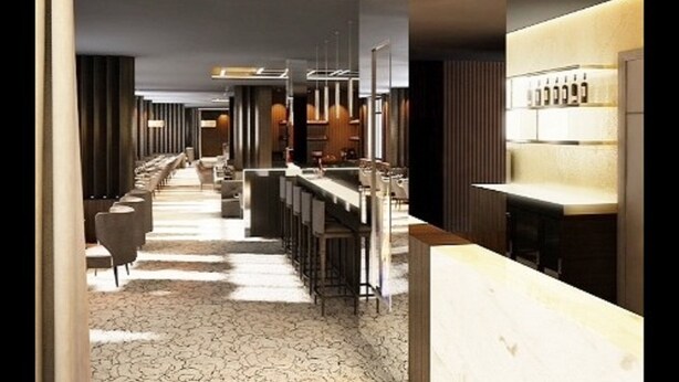 A modern hotel lobby with a long reception desk, bar area, and seating. - Howard Hôtel Paris Orly Aeroport (Paray-Vieille-Poste)