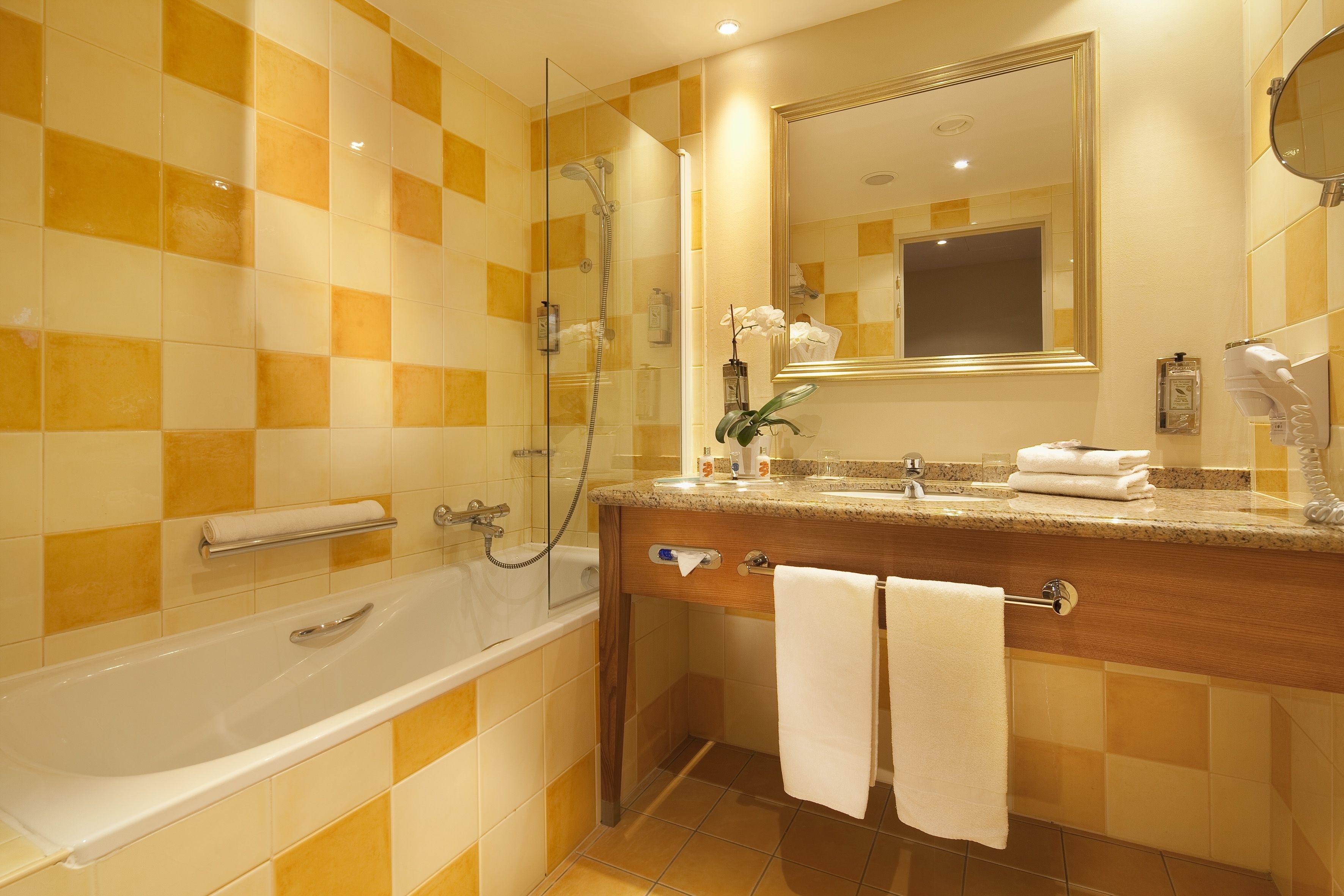 combined shower/bathtub, deep-soaking bathtub, designer toiletries