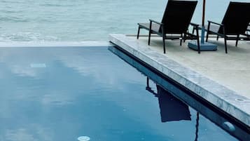 Outdoor pool, open 7 AM to 7 PM, pool umbrellas, sun loungers