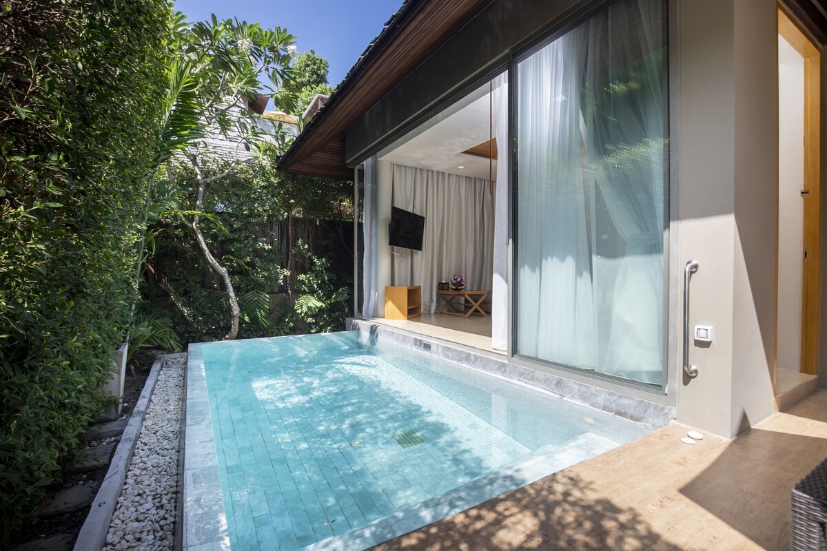 A modern house with a swimming pool, large sliding glass doors, and a well-maintained garden.