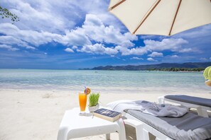 On the beach, white sand, beach umbrellas