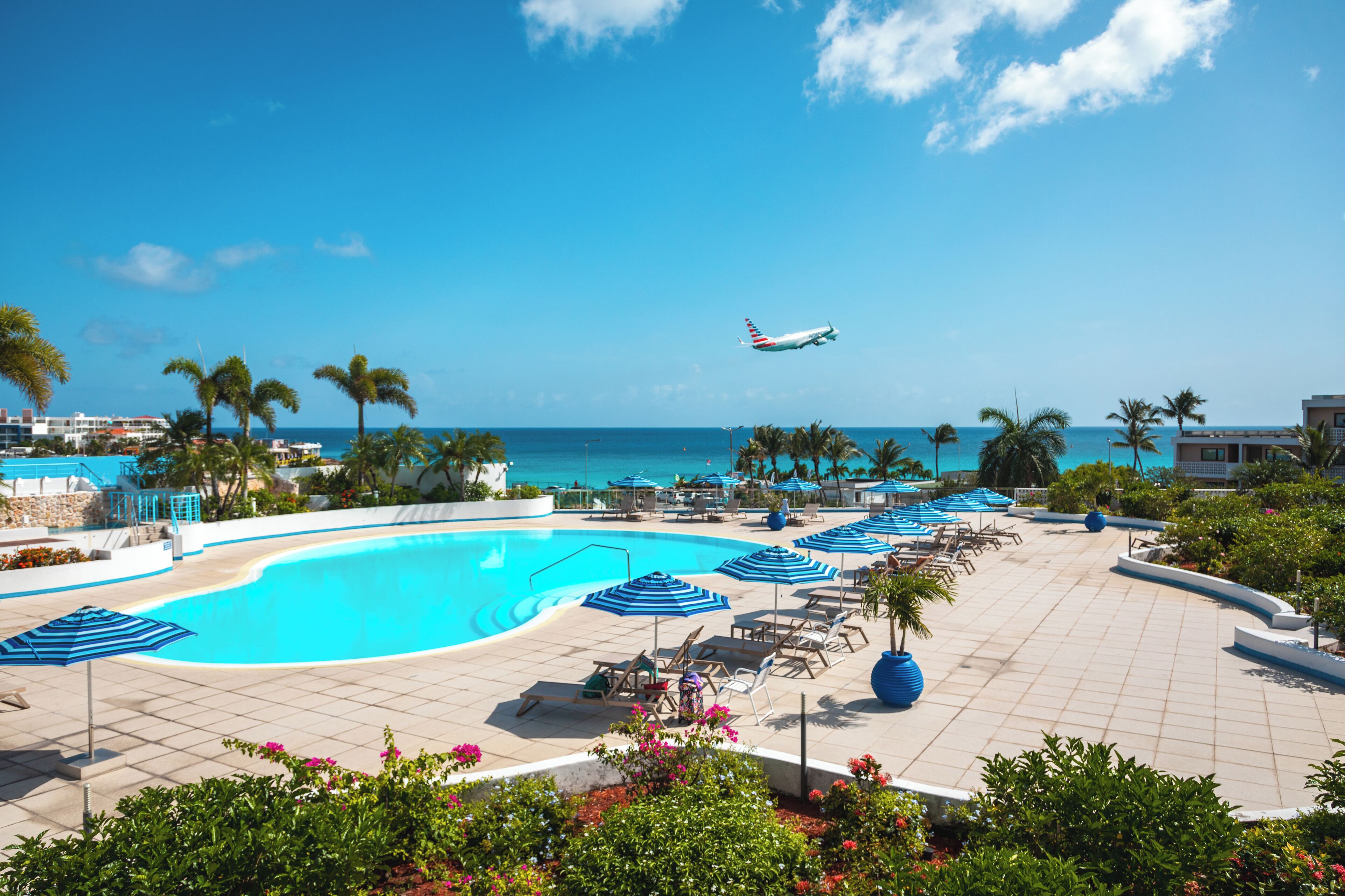 outdoor pool, pool umbrellas, pool loungers