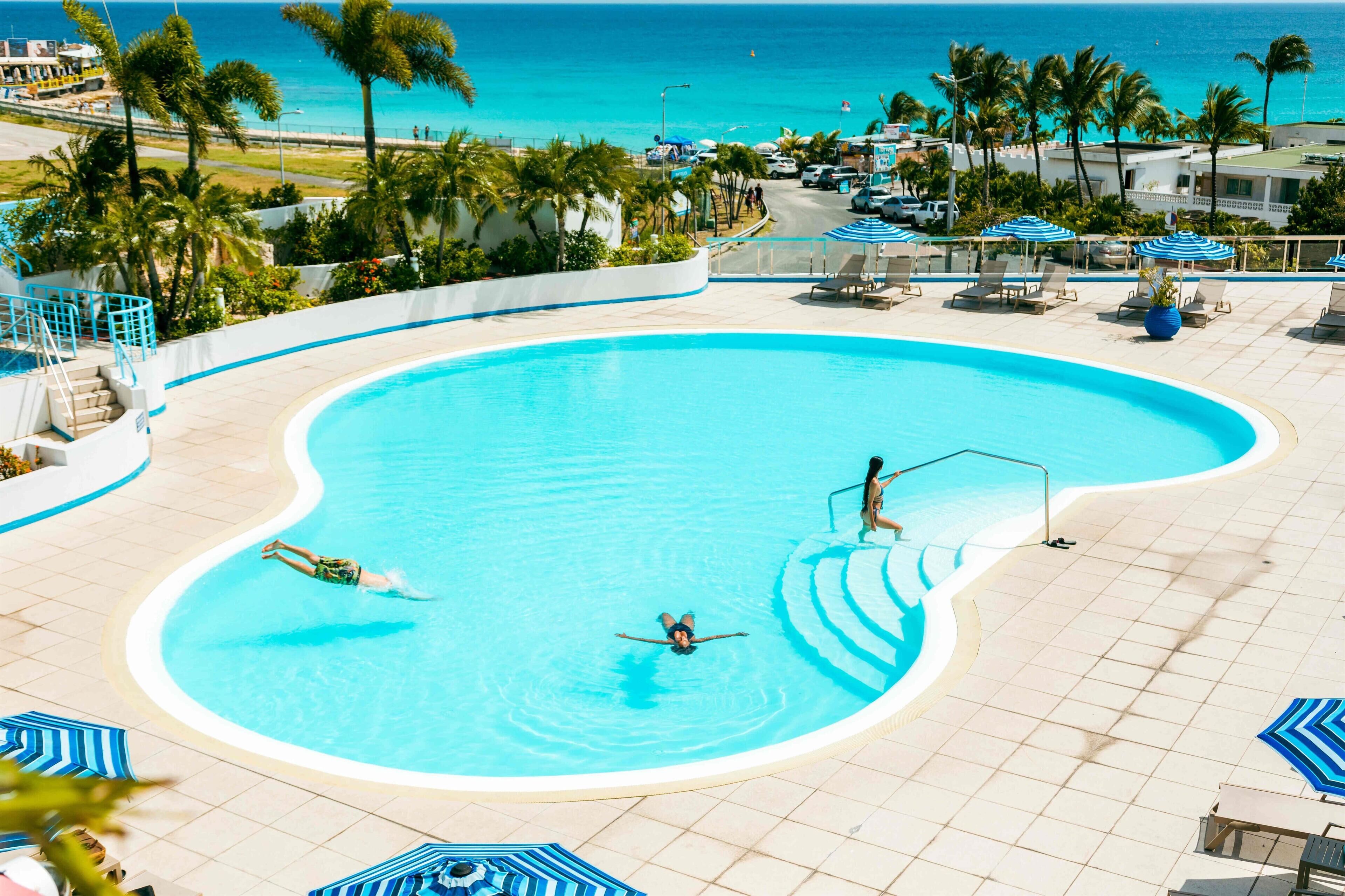 Outdoor pool, pool umbrellas, pool loungers