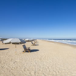 On the beach, white sand, beach towels