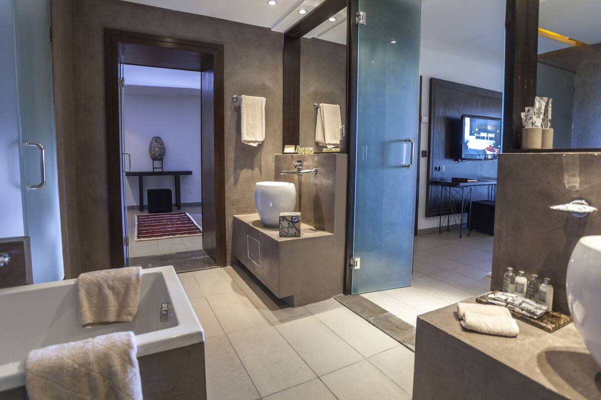 eco-friendly toiletries, hair dryer, bathrobes, slippers