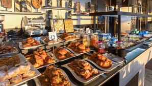 A buffet with various pastries and beverages. - Mövenpick Hotel Gammarth Tunis (La Marsa)