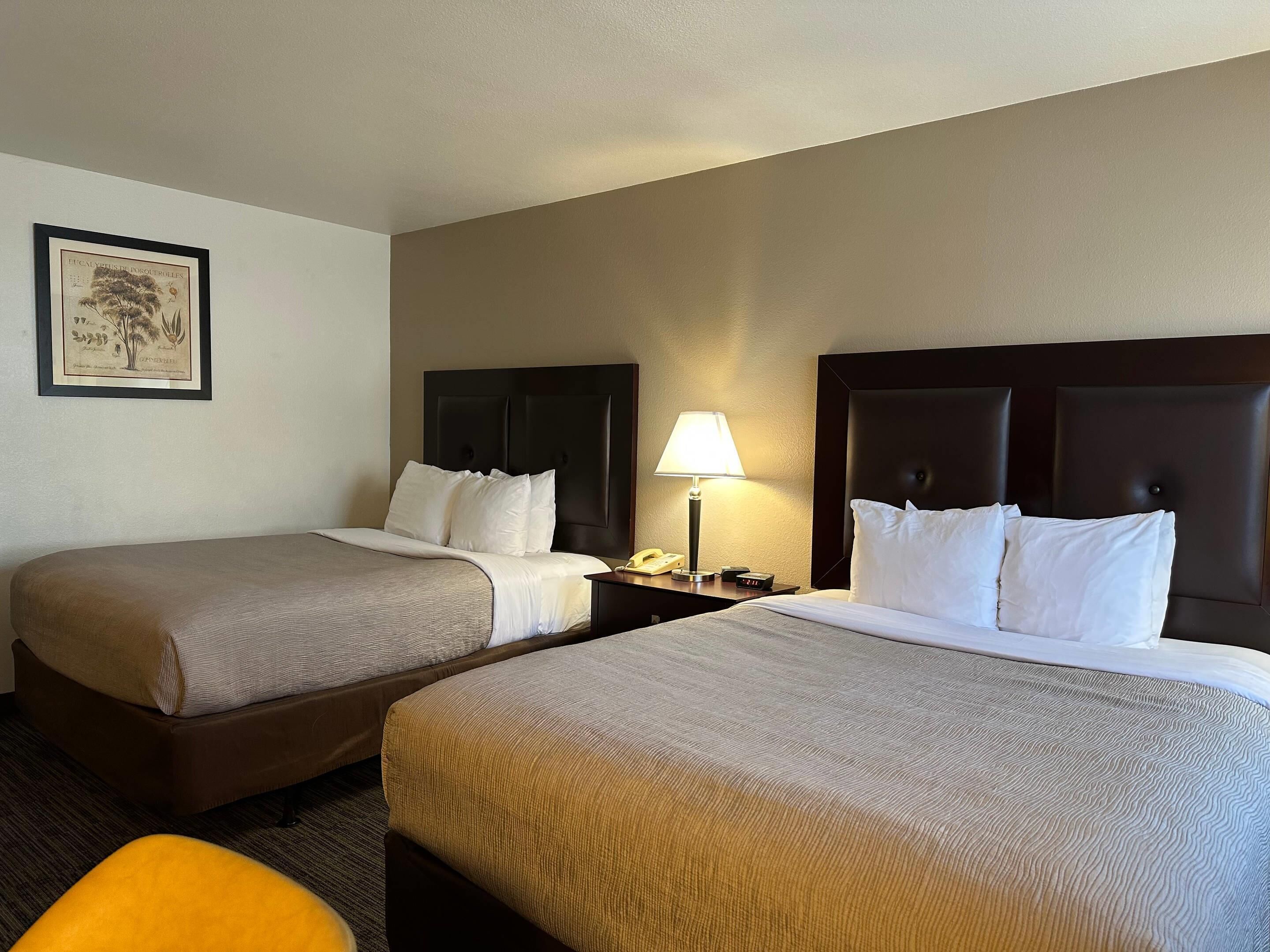 Standard Room, 2 Queen Beds, Non Smoking | Pillowtop beds, desk, laptop workspace, blackout drapes