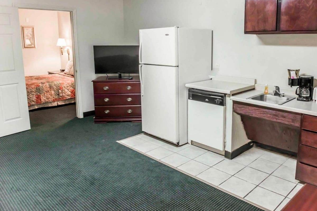 Desk, laptop workspace, iron/ironing board, free cribs/infant beds
