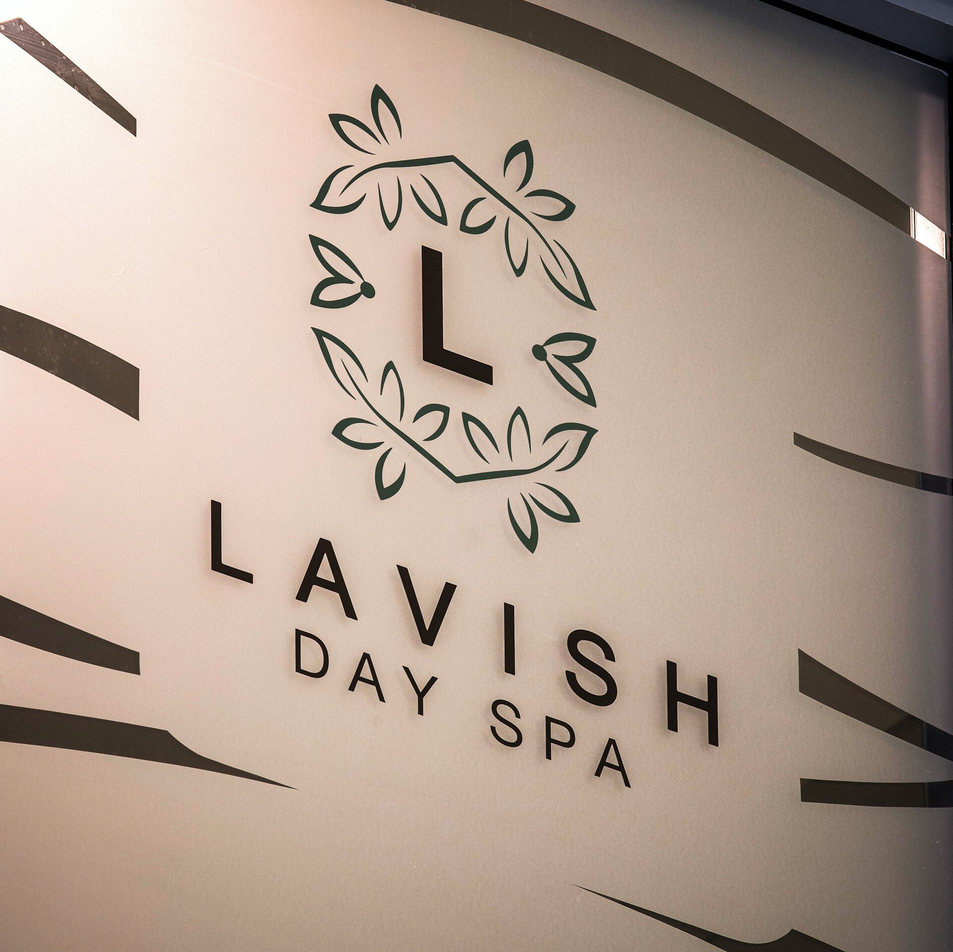 A logo with a stylized 'L' and the words 'LAVISH DAY SPA'.