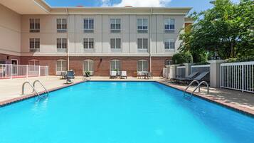 Outdoor pool, open 8 AM to 9 PM, pool loungers