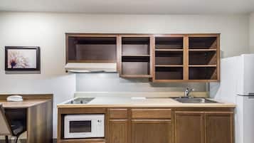 Full-size fridge, microwave, stovetop, freezer