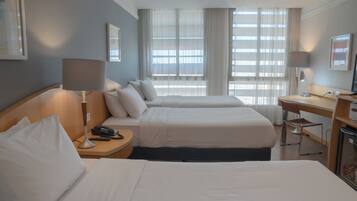 Superior Triple Room | Minibar, in-room safe, desk, blackout drapes