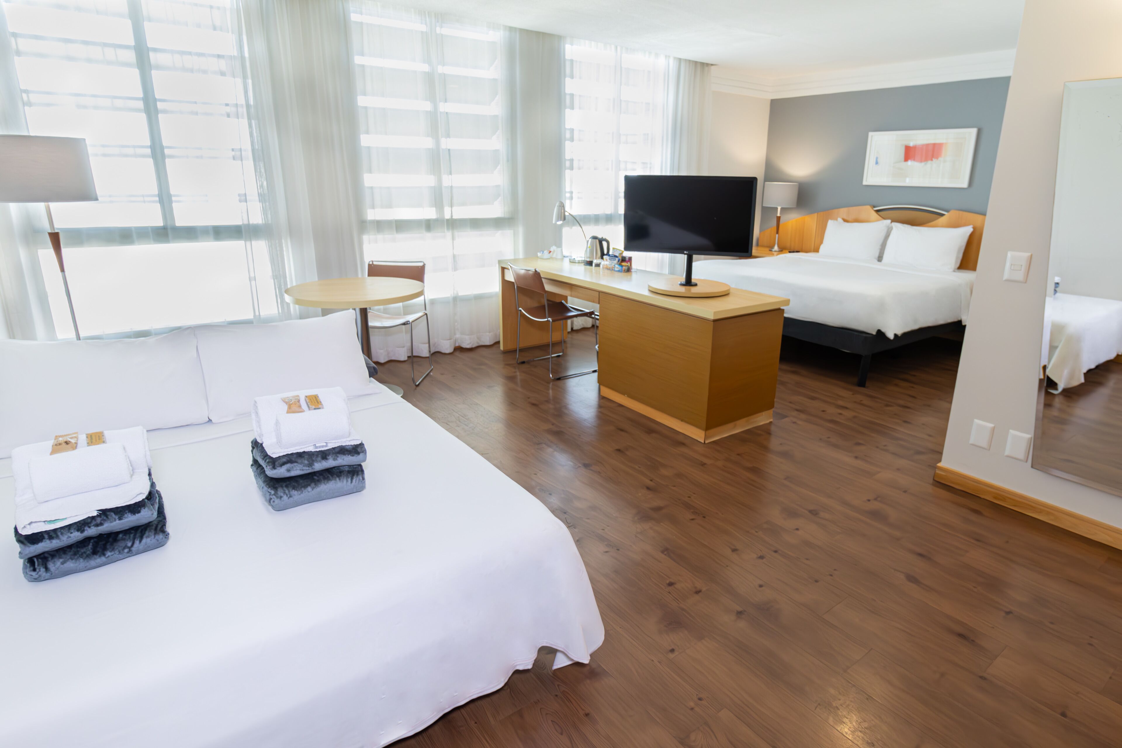 family room | 1 bedroom, minibar, in-room safe, desk