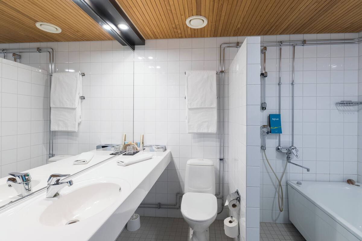 shower, hair dryer, bathrobes, slippers