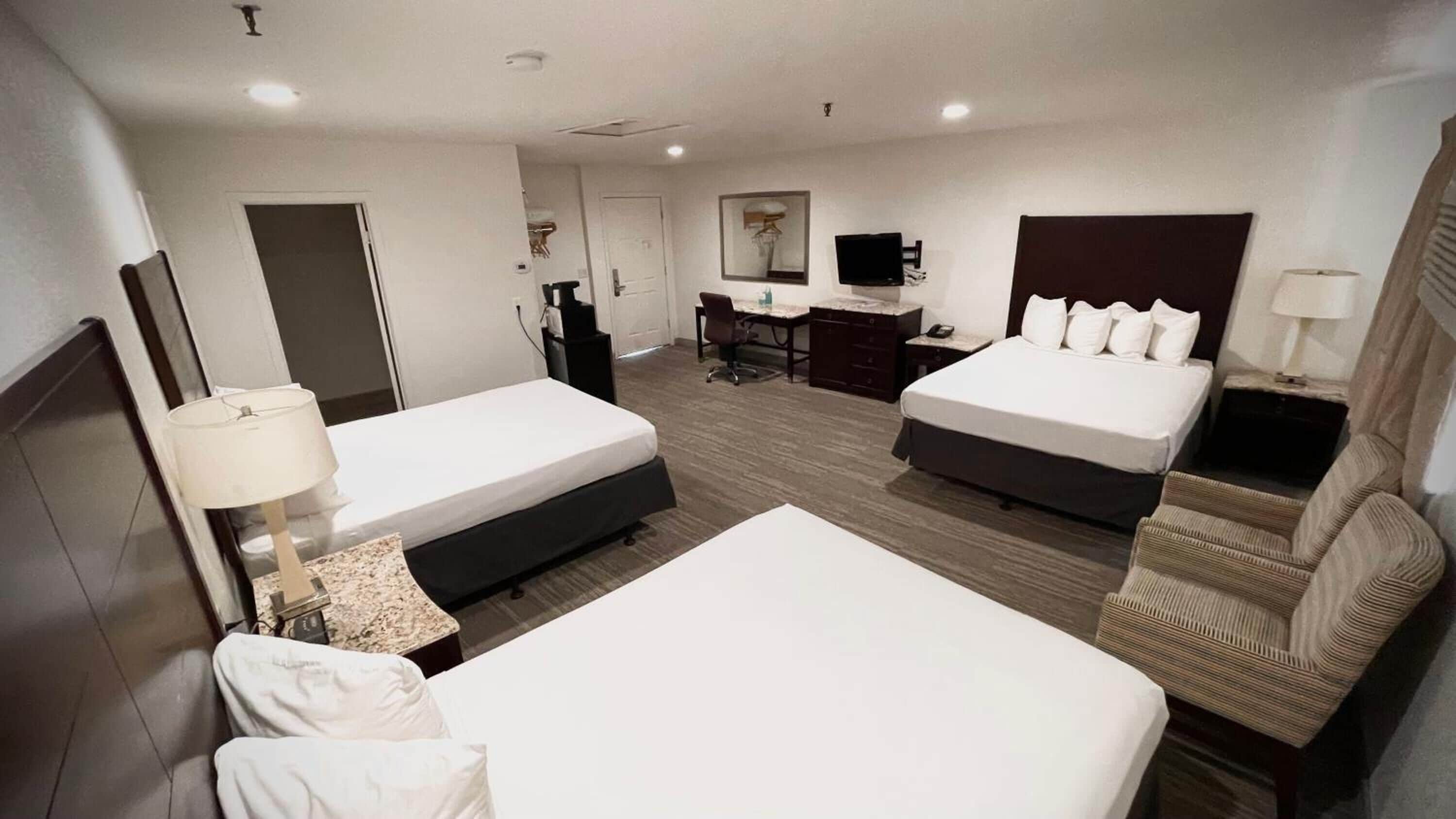 standard triple queen | 1 bedroom, premium bedding, desk, laptop workspace