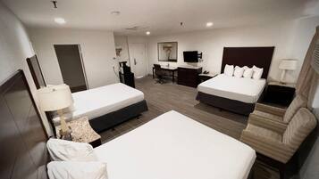 Premium bedding, desk, laptop workspace, blackout drapes