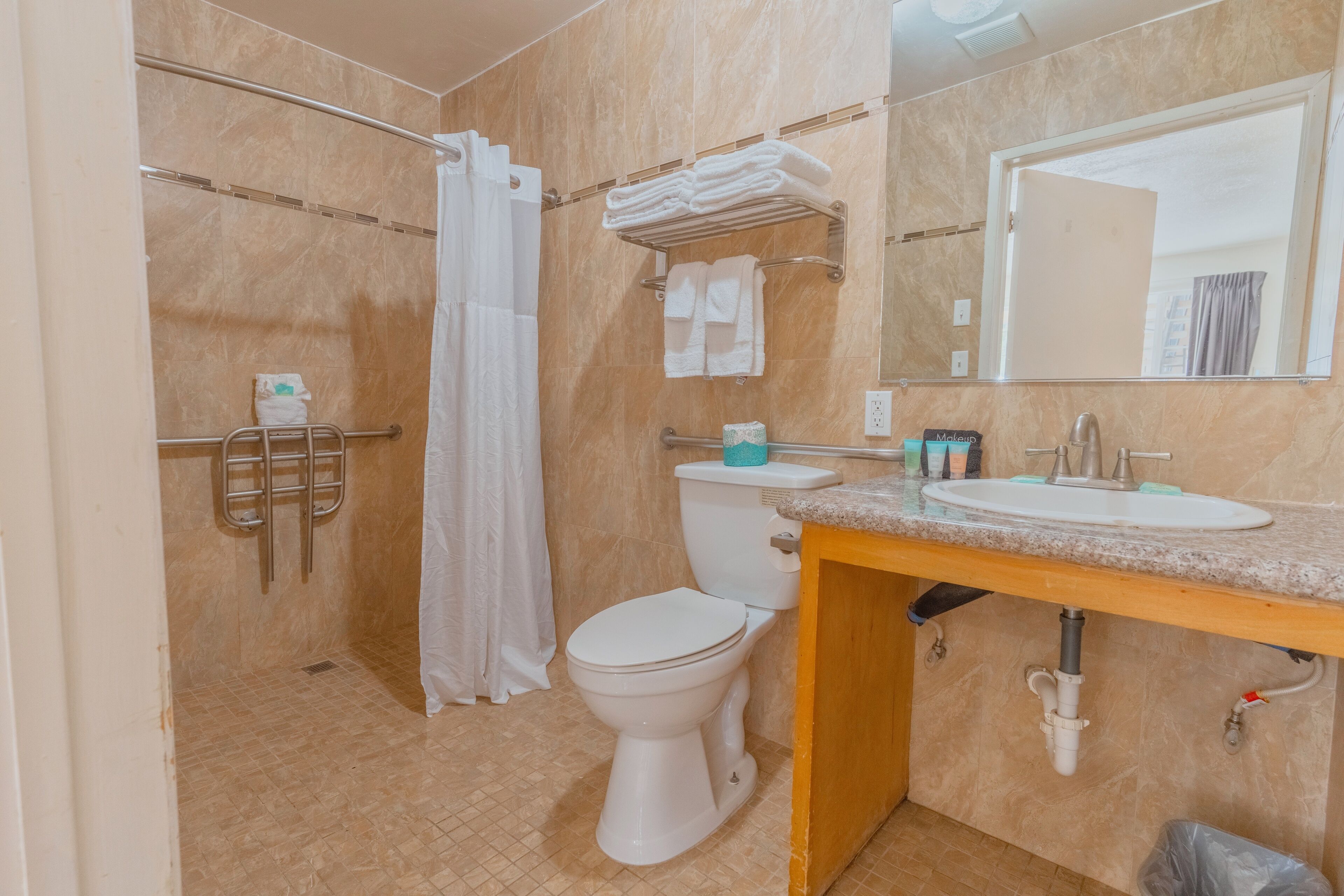 accessible double queen room | bathroom | combined shower/bathtub, free toiletries, hair dryer, towels