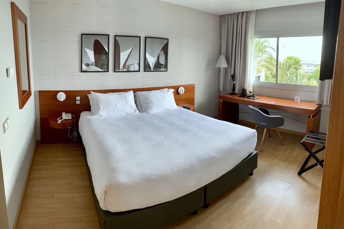 room, 1 king bed, pool view | 1 bedroom, in-room safe, desk, blackout curtains