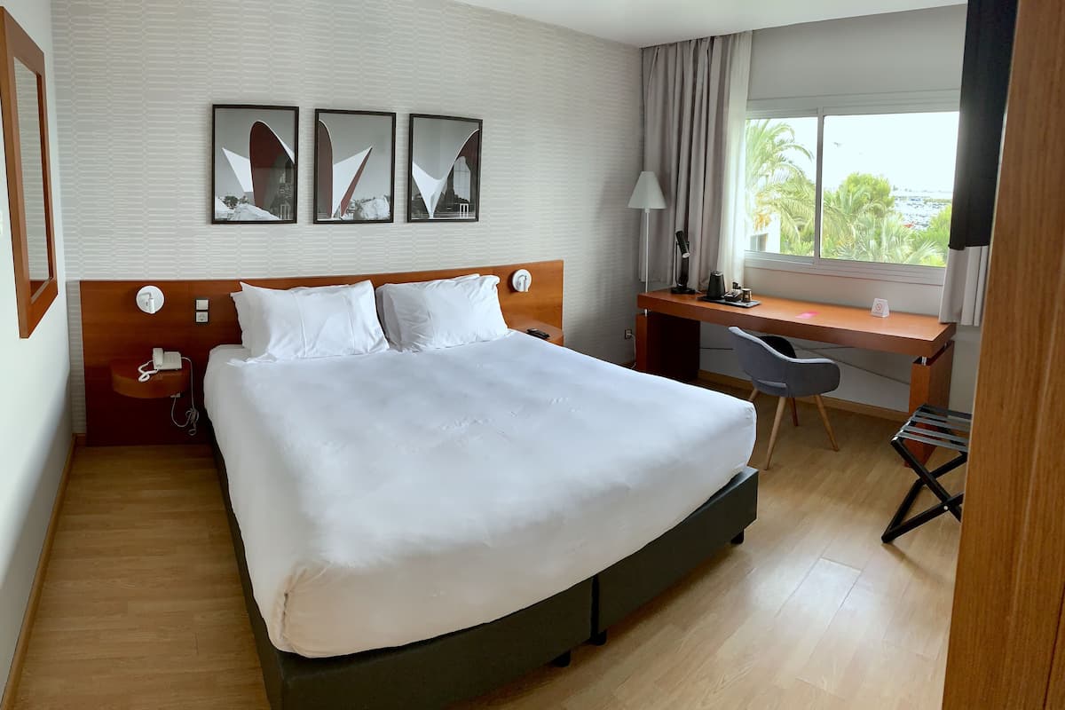 Room, 1 King Bed, Pool View | In-room safe, desk, blackout drapes, soundproofing