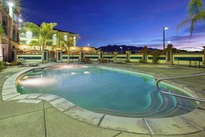 A swimming pool with lounge chairs and a building in the background. - Holiday Inn Express & Suites Tucson Mall by IHG (Tucson)