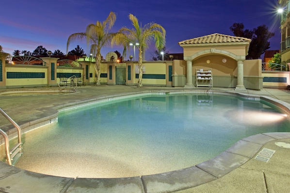 Outdoor pool, open 10:00 AM to 7:00 PM, pool loungers