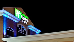 A hotel with a prominent 'Holiday Inn Express' sign, a covered entrance, and a brick facade. - Holiday Inn Express Sumter by IHG (Sumter)