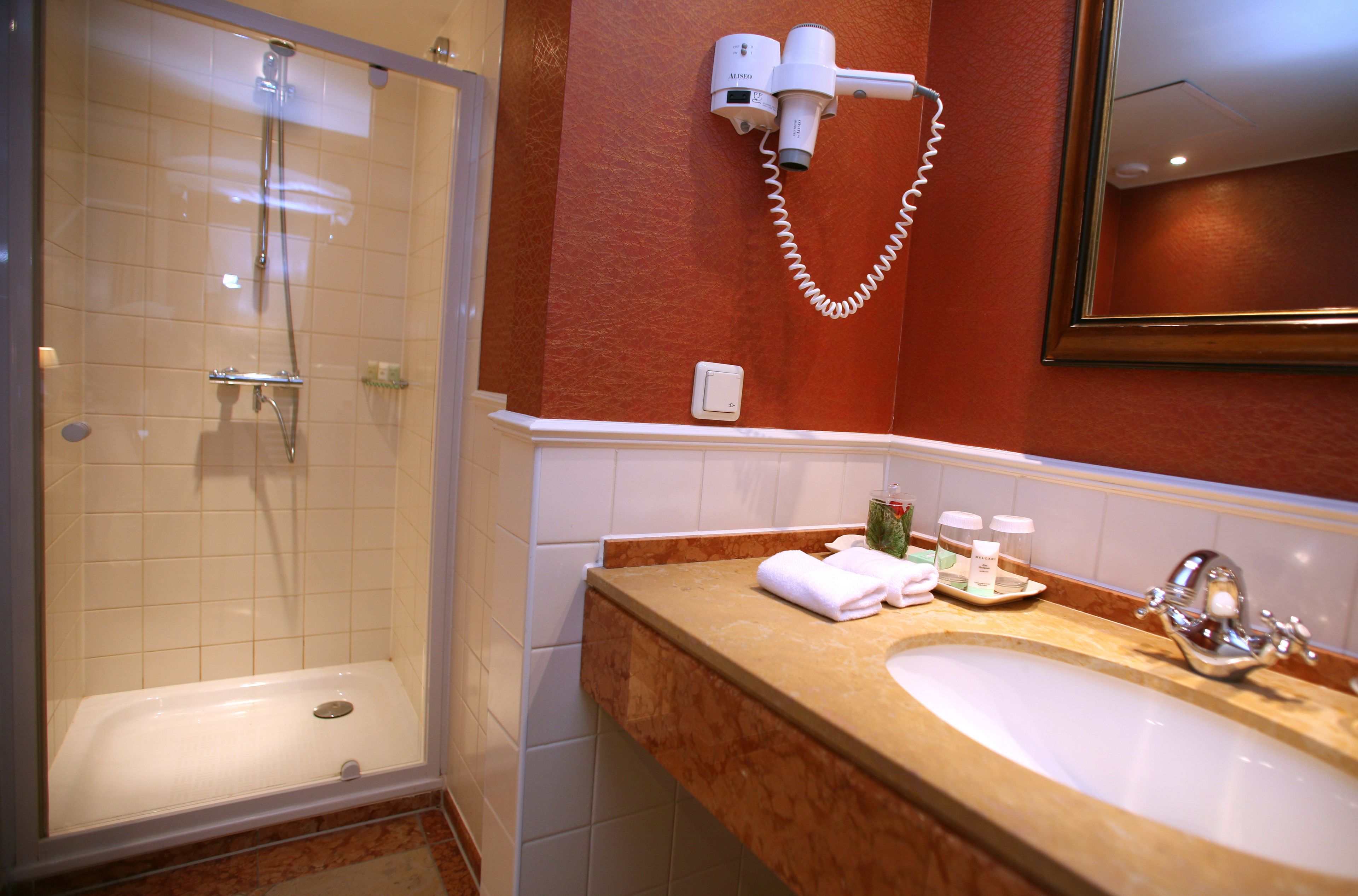 shower, free toiletries, hair dryer, towels