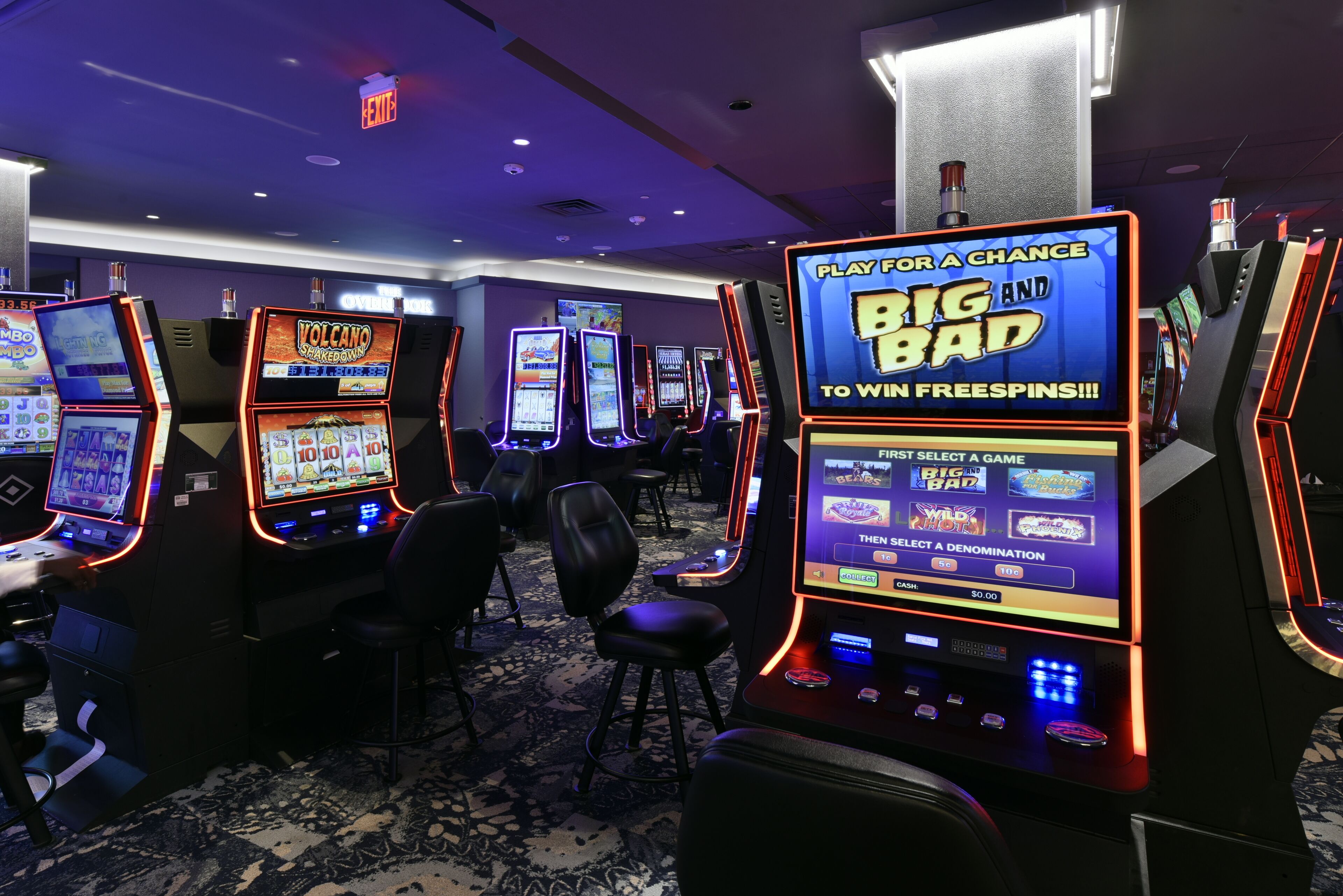 A casino floor with multiple slot machines and a prominent 'BIG BAD' sign.