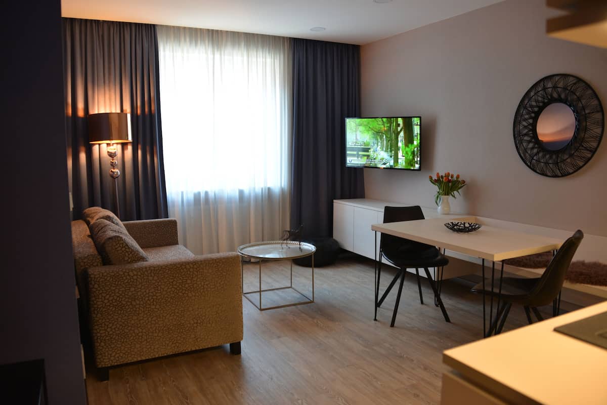 Family Suite, 2 Bedrooms, 2 Bathrooms | Living area | LCD TV
