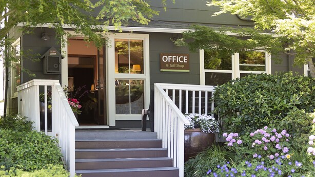 A building with a sign that reads "OFFICE Gift Shop" at the entrance.