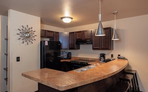 Family Condo, 2 Bedrooms, Kitchen | Private kitchen | Microwave, coffee/tea maker - Sunset Bay Resort (Wisconsin Dells)