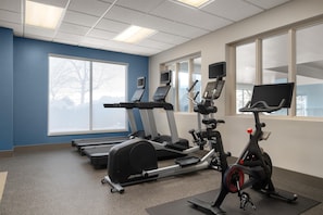 A gym with treadmills, elliptical machines, and stationary bikes. - Hilton Garden Inn Indianapolis/Carmel (Carmel)