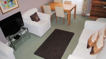 Standard Apartment, 1 Bedroom | Living area | TV, DVD player