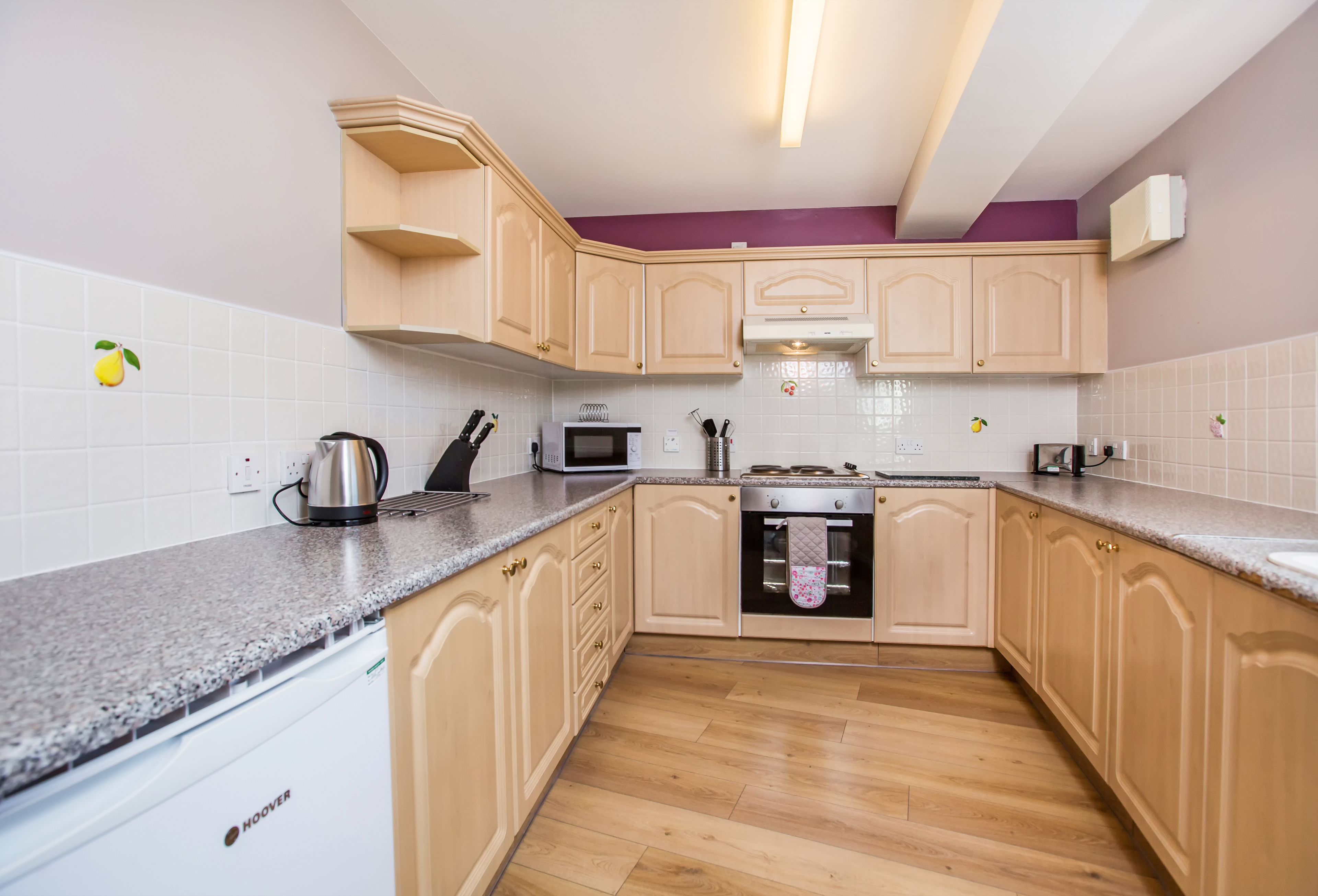 Fridge, microwave, coffee/tea maker, cookware/dishes/utensils