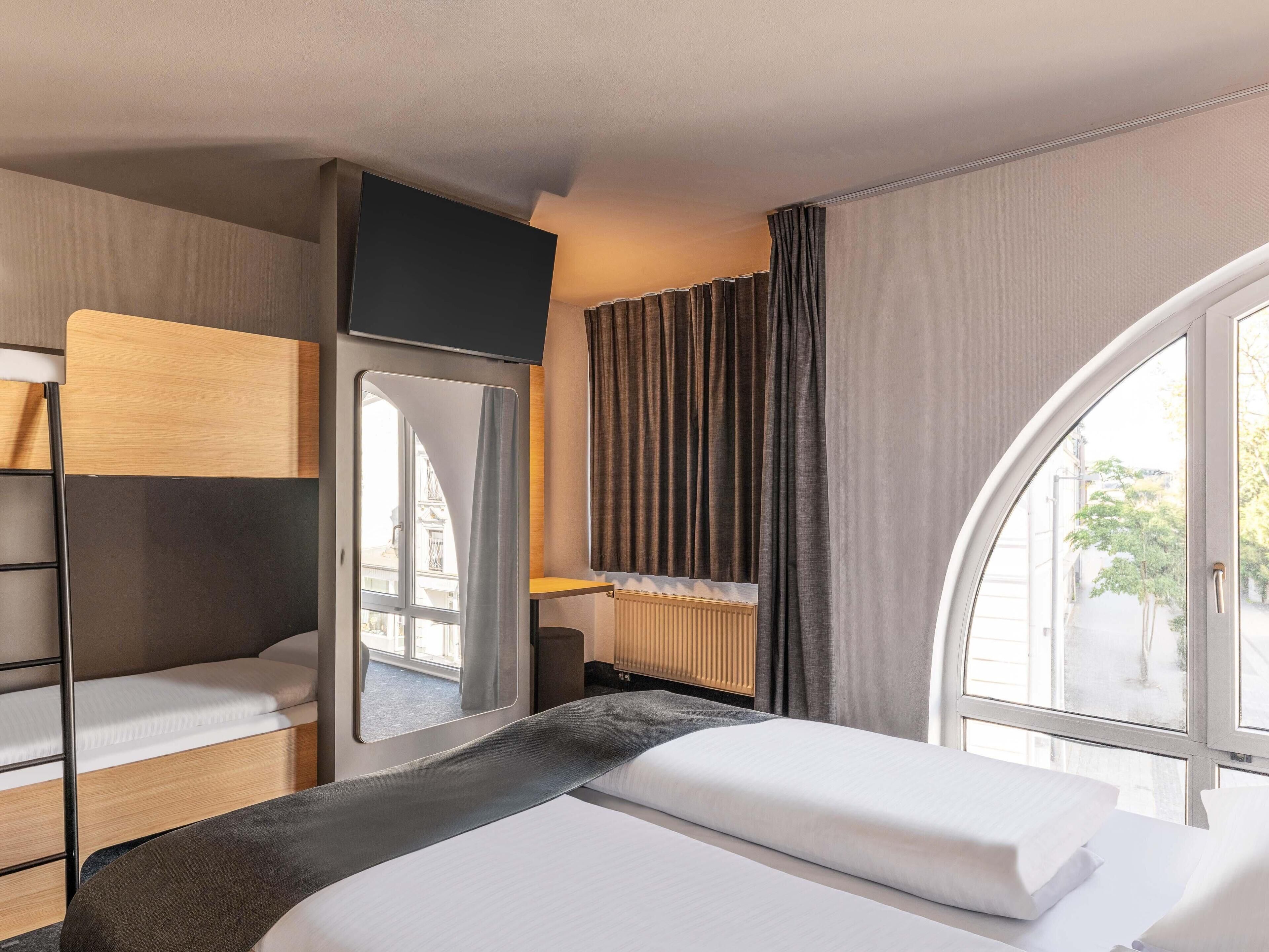 Desk, blackout drapes, soundproofing, free WiFi