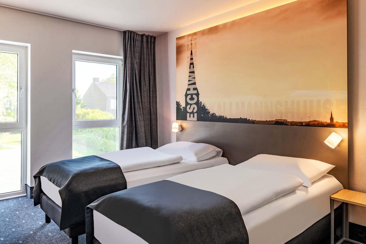 Habitación con 2 camas individuales | Escritorio, cortinas opacas, sistema de insonorización y wifi gratis