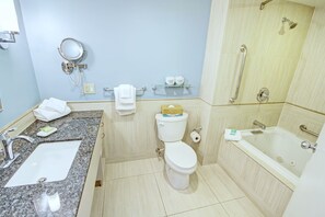 A bathroom with a sink, toilet, and bathtub. - Club Wyndham Inn on Long Wharf (Newport)