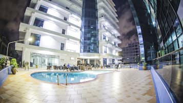Outdoor pool, pool umbrellas, sun loungers