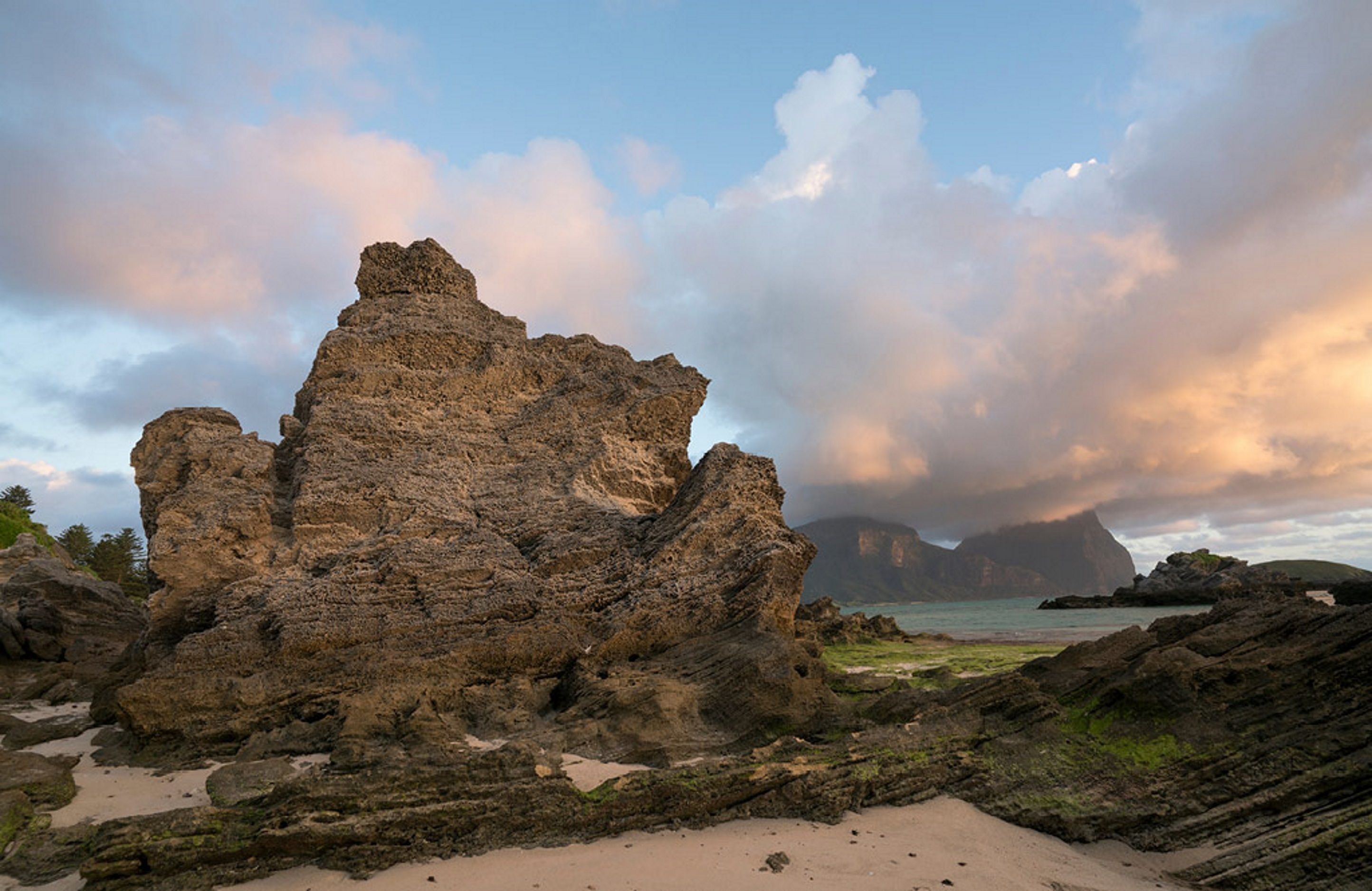 beach nearby, white sand, beach umbrellas, beach towels