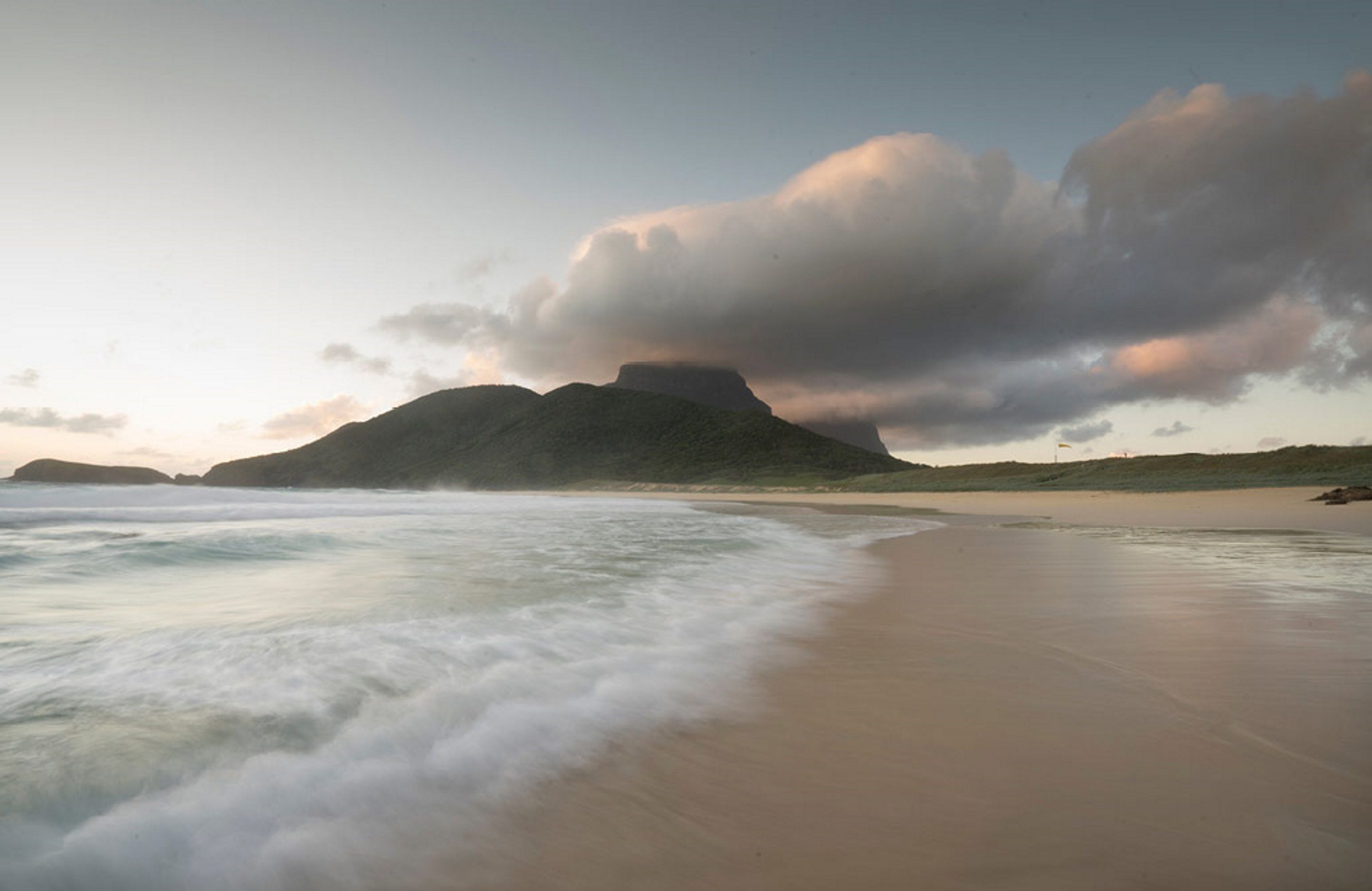 Beach nearby, white sand, beach umbrellas, beach towels