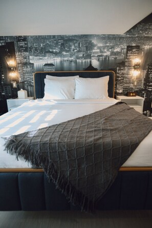 Ropa de cama de alta calidad, minibar y tabla de planchar con plancha 