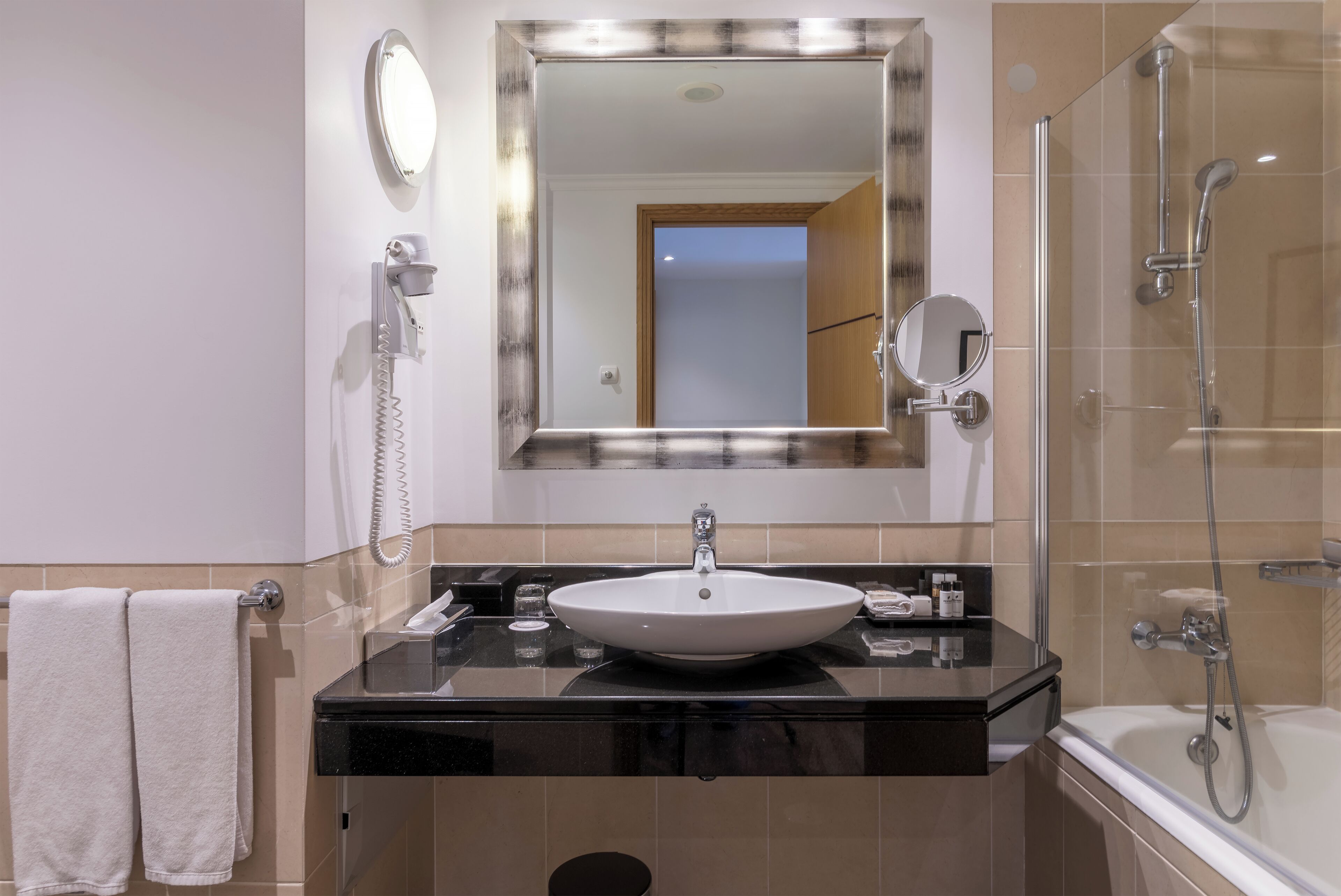 family room | bathroom | bathtub, free toiletries, hair dryer, bathrobes