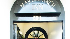 The entrance to Marble Arch Inn, featuring a black archway with the name and number 49. - Marble Arch Inn Hotel (London)