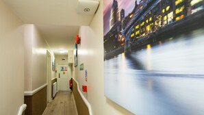 A hallway with a view of a river at night. - Marble Arch Inn Hotel (London)