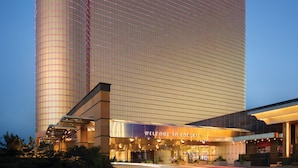 A large hotel building with a prominent 'Borgata' sign, featuring a modern architectural design with a curved facade and a well-lit entrance. - Borgata Hotel Casino & Spa (Atlantic City)