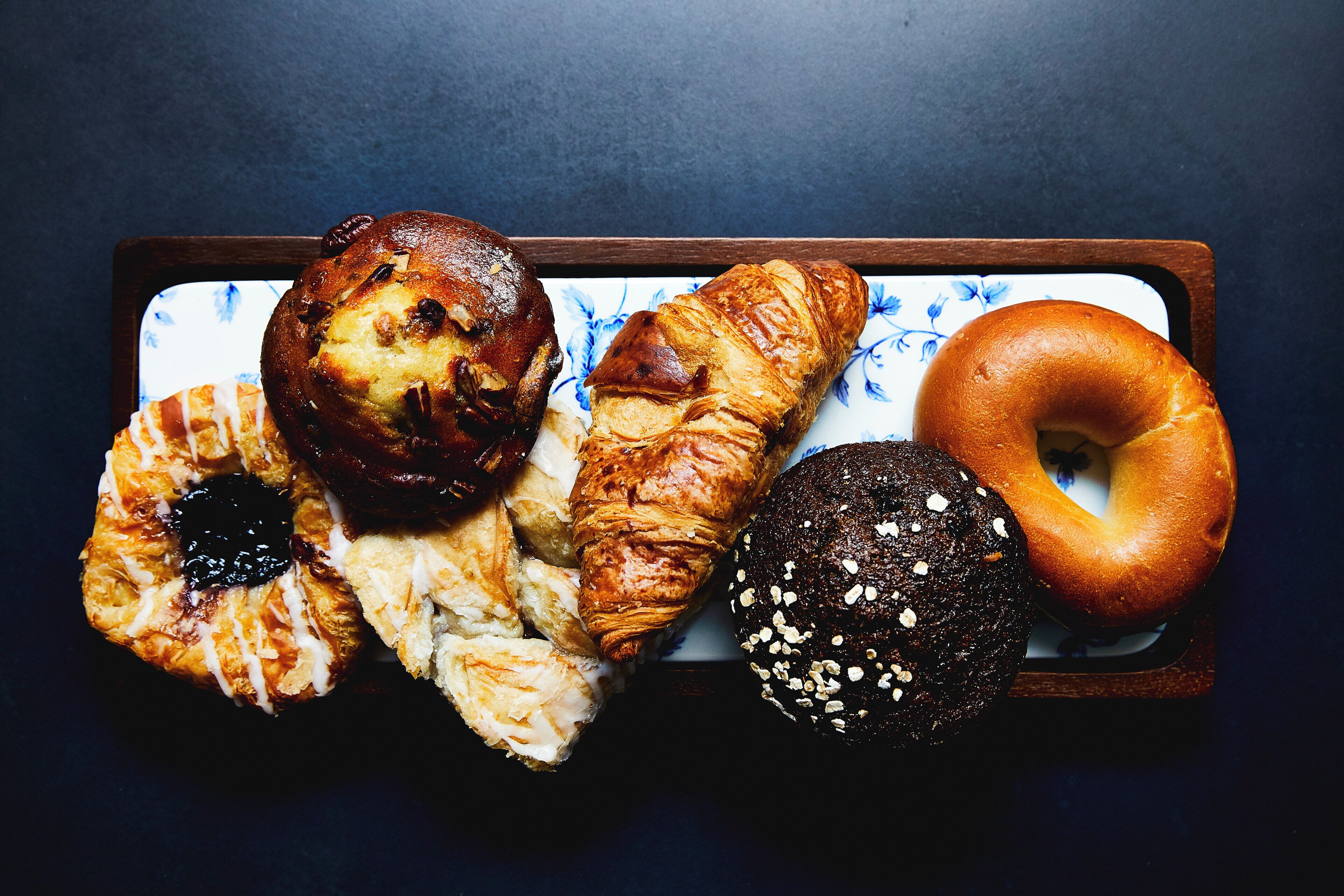 A variety of baked goods on a tray.